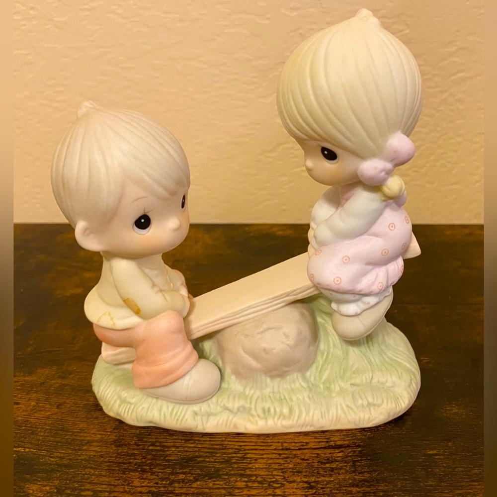 Artwork by the late Sam Butcher. Retired Precious Moments Figurine.